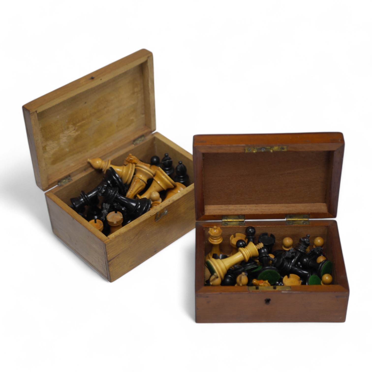 A chess set, possibly F H Ayres, in a mahogany box, and another larger weighted chess set, in box, Ayres Kings 6cm. Condition - good